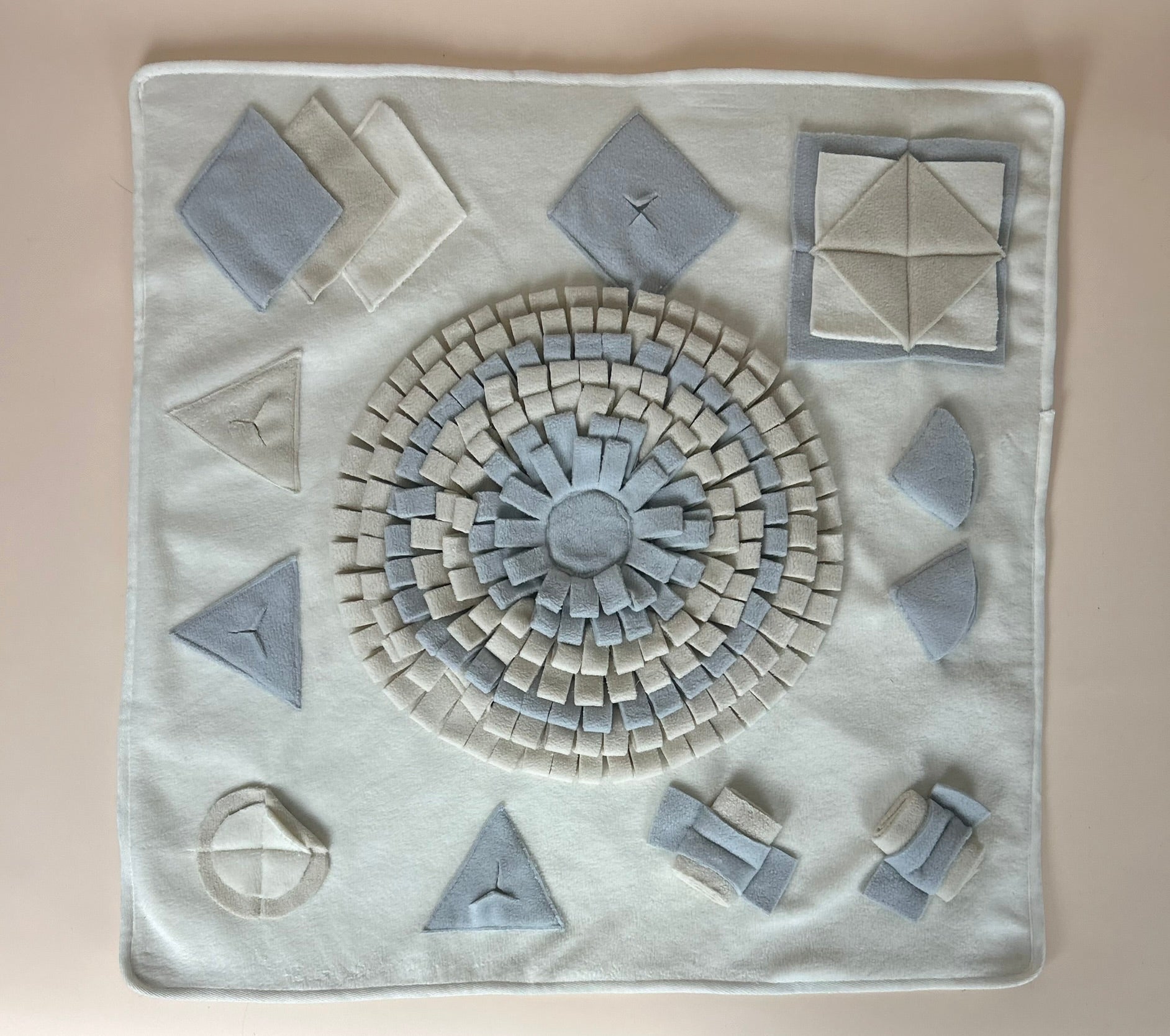 The Nest Mat calm enrichment mat for cats and dogs laid flat on neutral background